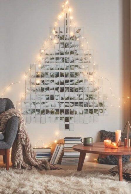 A fake Christmas tree with polaroid photos and a light garland (1)