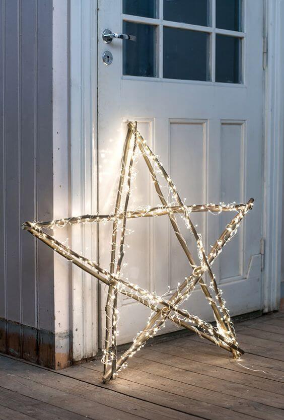 A giant Christmas star with sticks and a light garland (1)