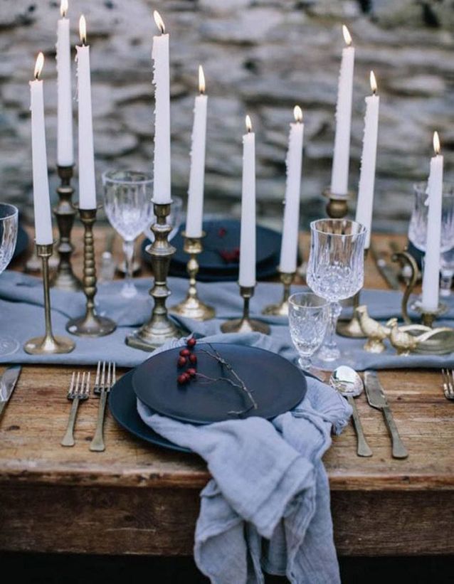 A table runner with mismatched candlesticks