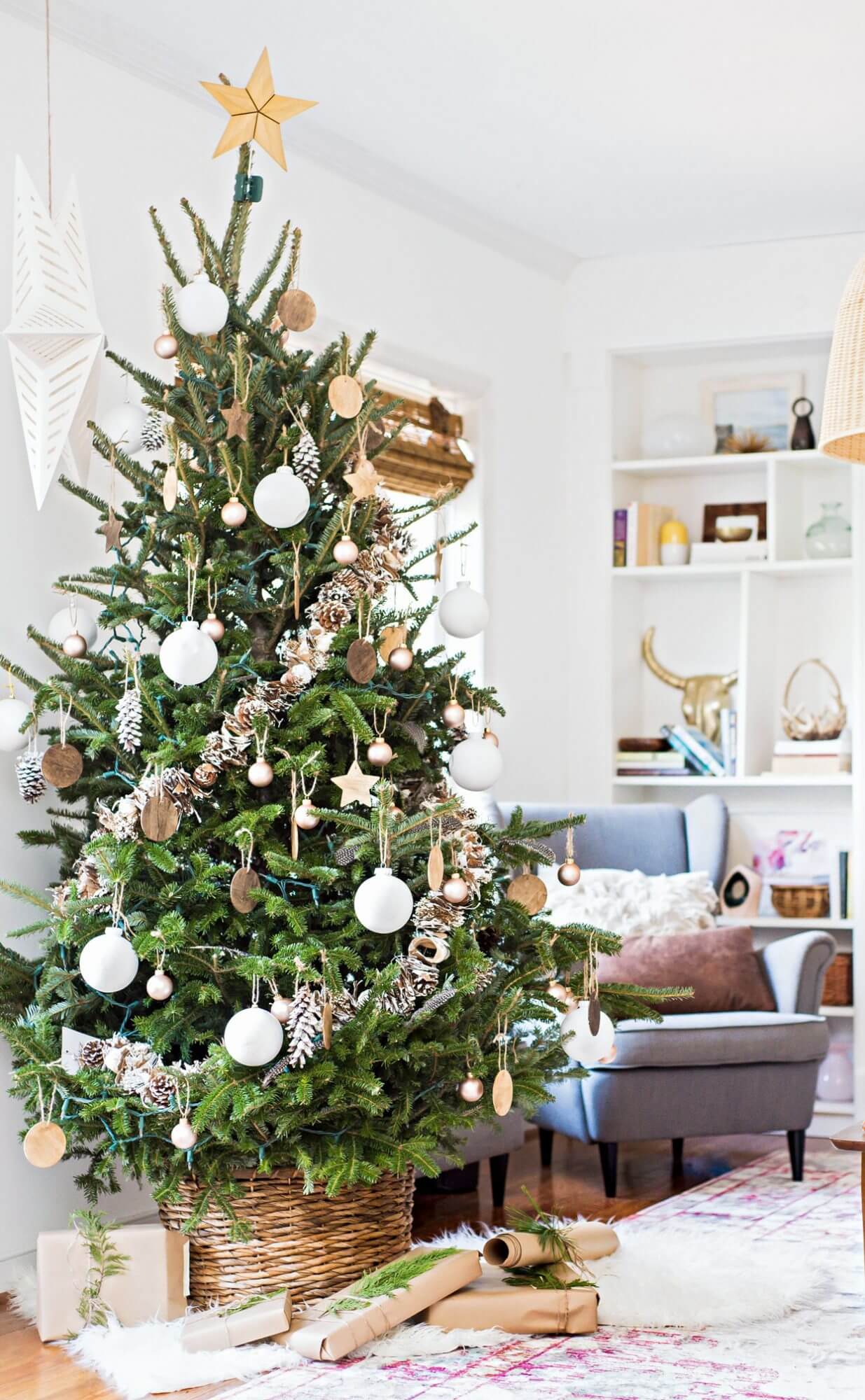 A white and golden tree for a real holiday decoration 