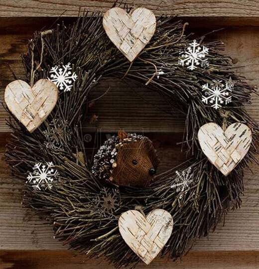 Dried branches with wooden hearts 