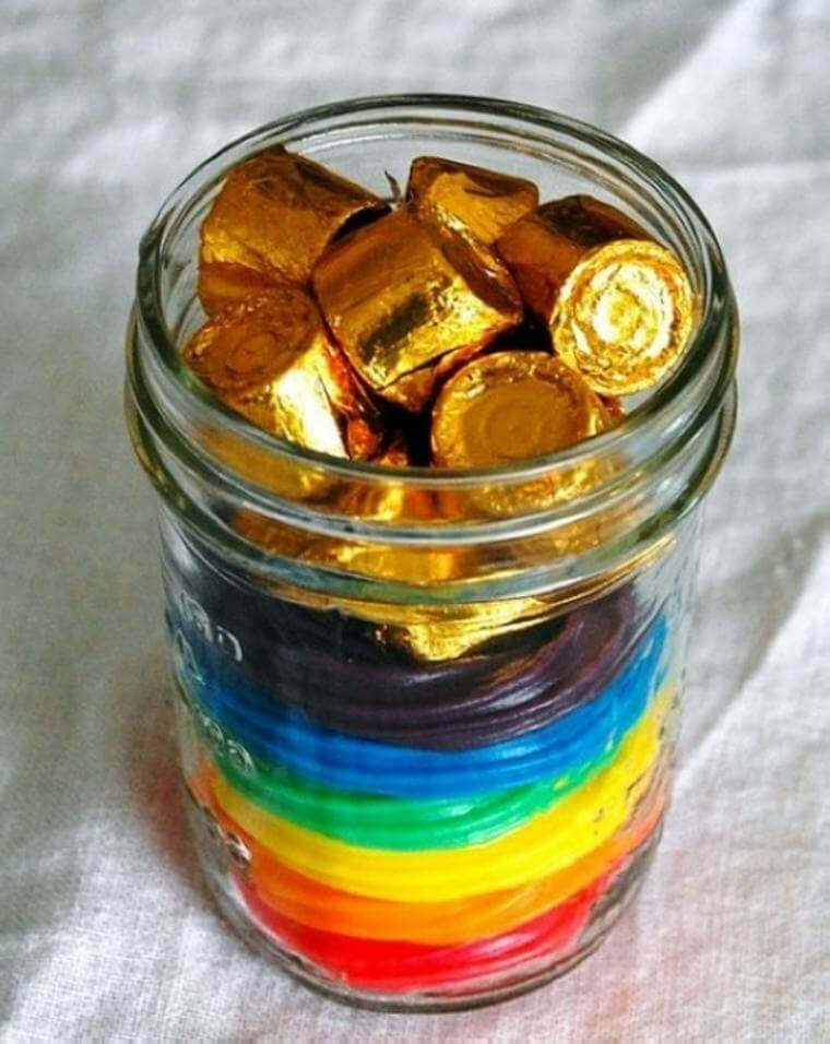 A glass jar that is used to store chocolates and candies 
