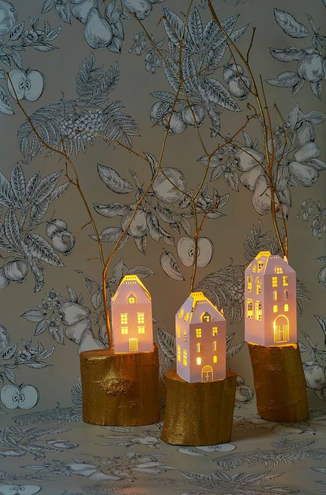 Candle holders in the shape of lighted houses (1)