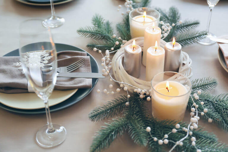 Candles, pearls and firs as centerpiece