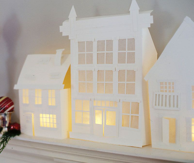 Create a cardboard candle holder village