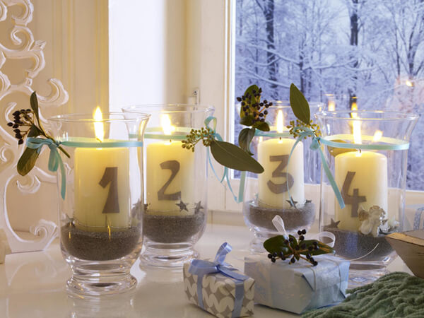 Large white candles placed in glass candle holders (1)