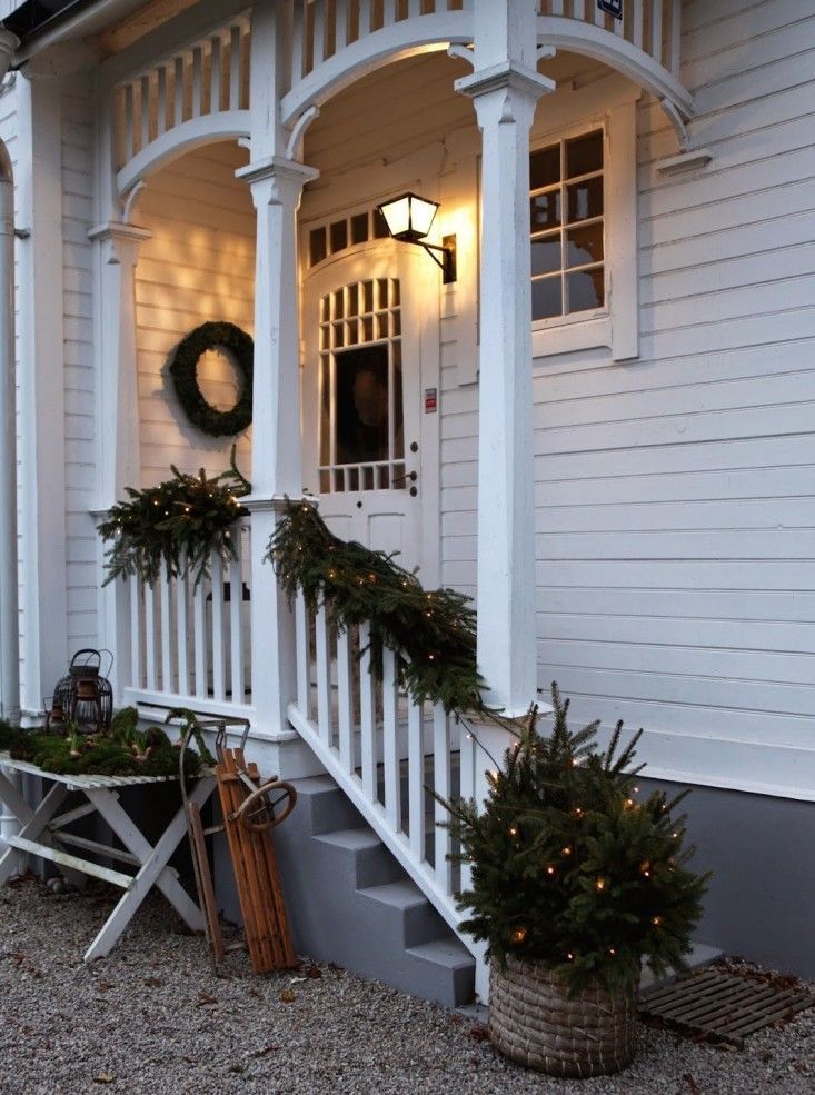 Use fir branches to dress a railing at Christmas time