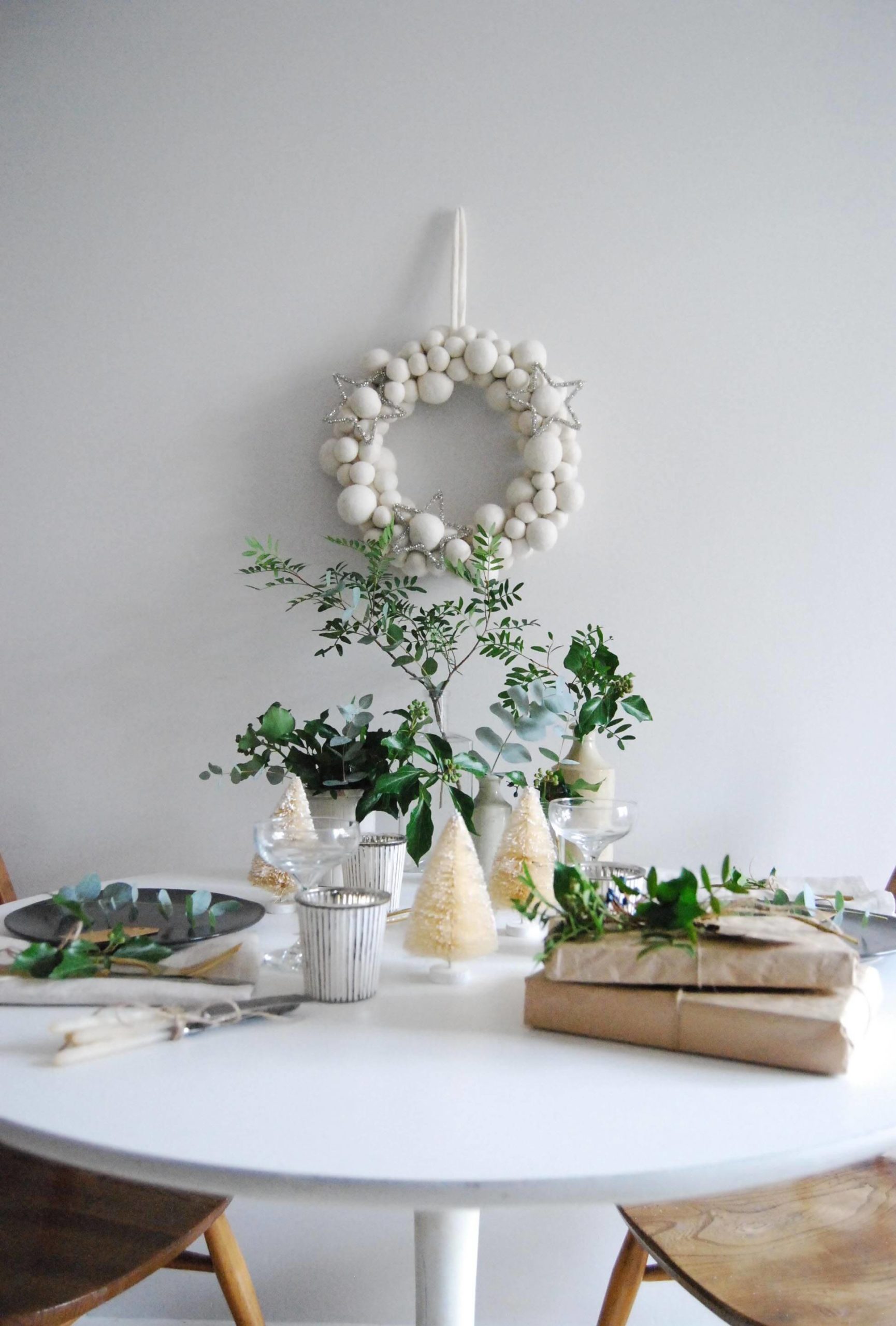 White Christmas wreath, decorative trees and greenery as an accent on the table (1)