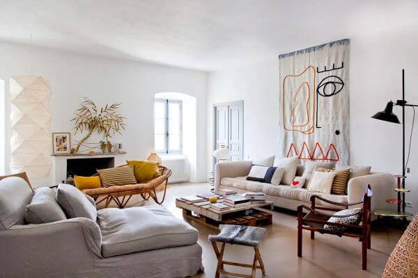 A beige and white living room mixes with recycled furniture (1)