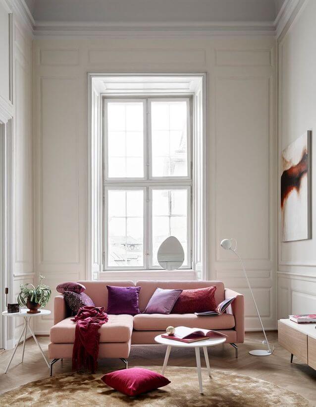 A white living room softened by a pink sofa (1)