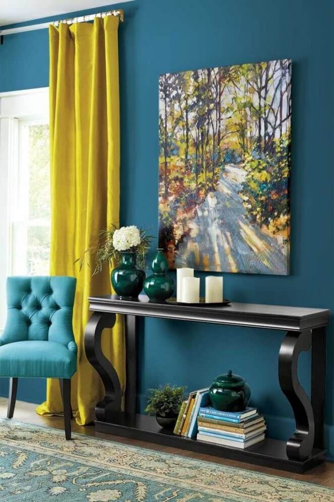 Living room with teal blue wall and yellow curtain (1)