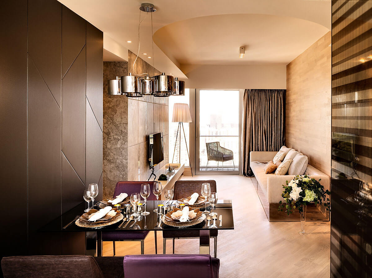 Wall paneling in dark brown, modern chairs in brown and purple (1)