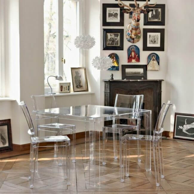 A dining table and transparent chairs in the kitchen (1)