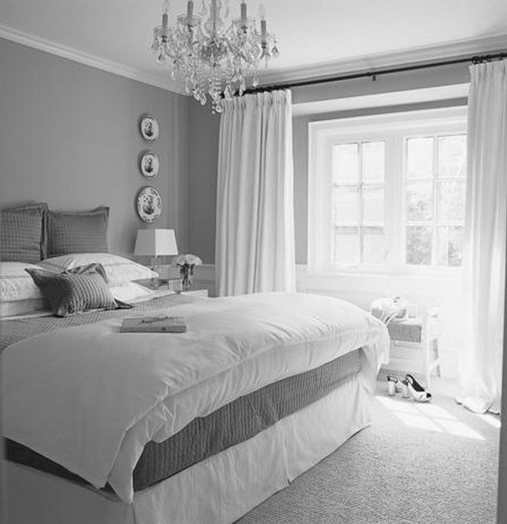 A gray bedroom that plays with white