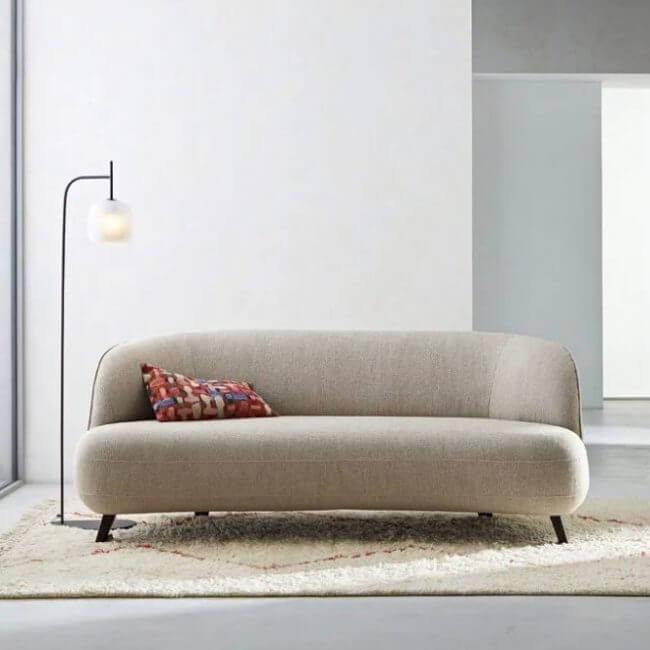 Get a cocooning atmosphere in the living room with a curvy sofa (1)