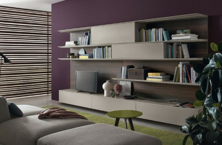 This living room with its purple solid on one wall is typical of the flagship trend of this winter (1)