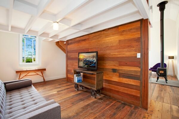 A wooden wall in a half industrial half Scandinavian living room (1)