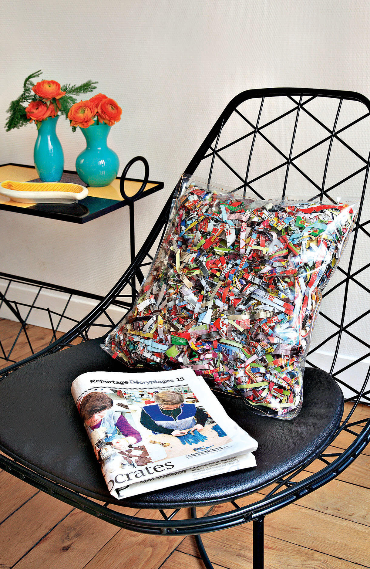 Cushion in newspaper clippings and plastic (1)