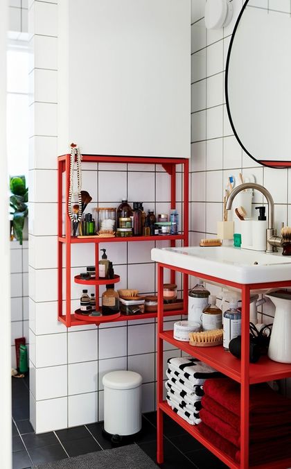 Red metal storage for a modern industrial style bathroom