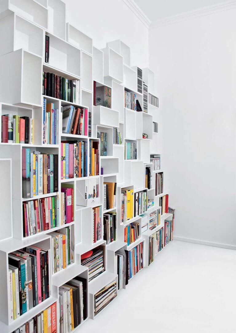 White bookcase with an original design for storing books (1)