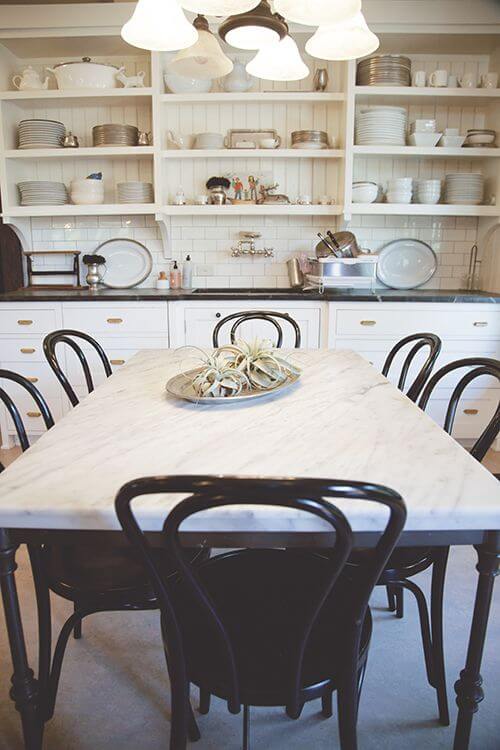 White marble table with black chairs (1)