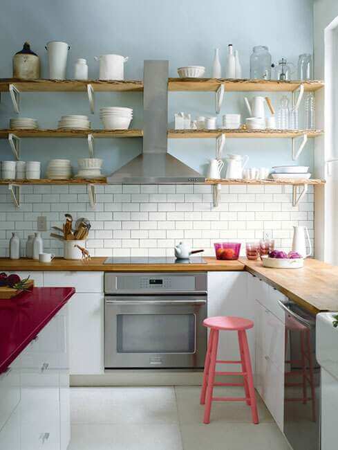 A kitchen with a section of pastel blue wall (1)