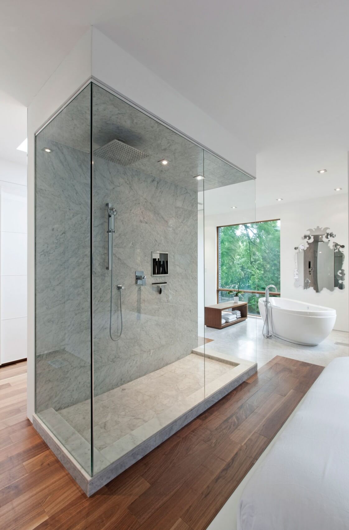 A marble shower surrounded by wooden floor (1)