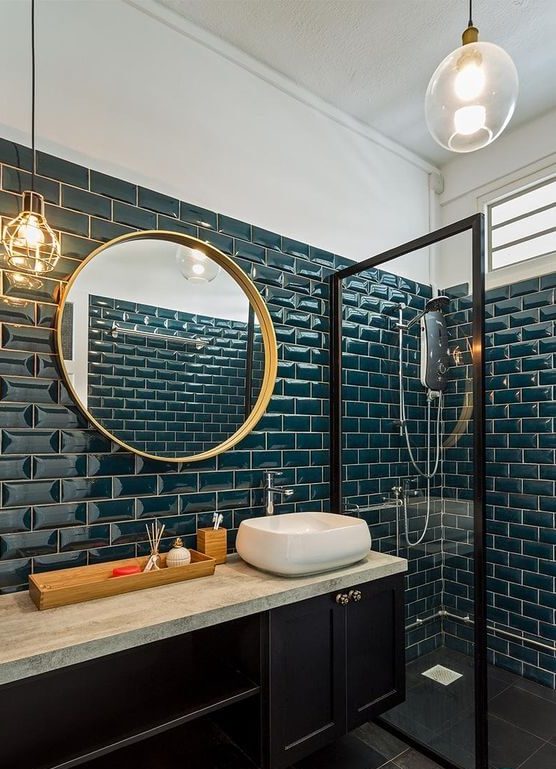 bathroom clad in teal tiles (1)