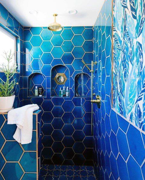 blue bathroom clad in hexagonal tiles (1)