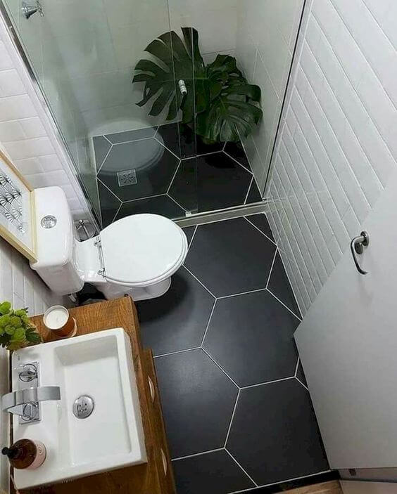 A bathroom with open shower and WC (1)
