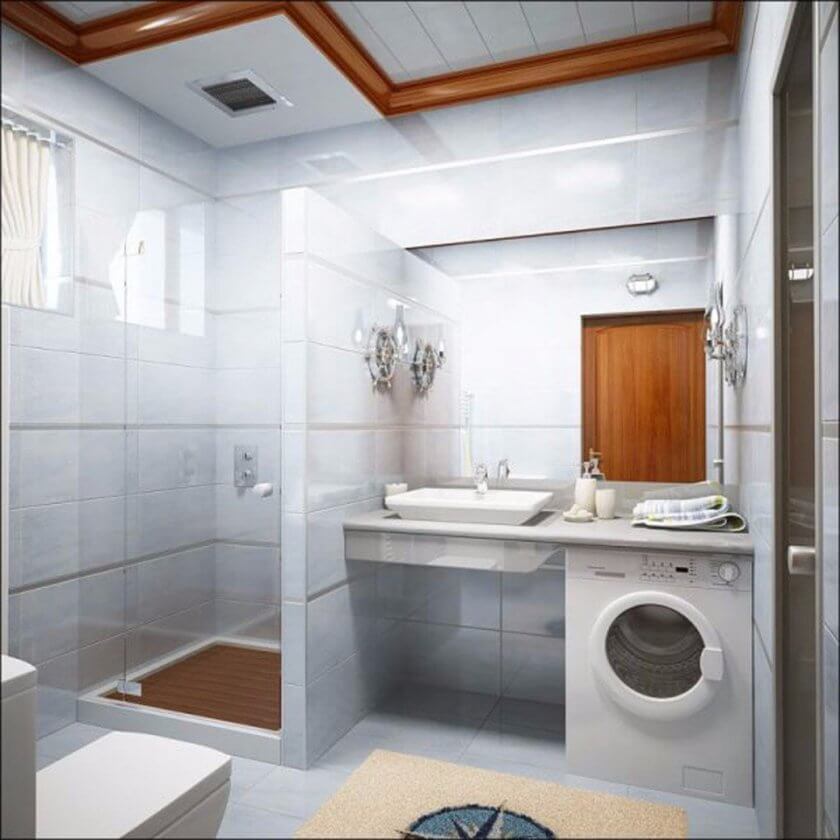 A small bathroom with washing machine (1)