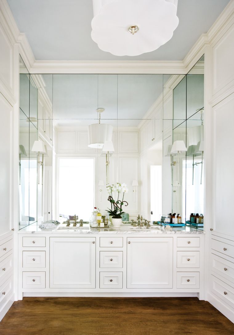 Large bathroom glass mirror with white cabinets