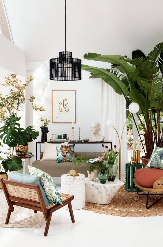 White living room decorated with green plants (1)