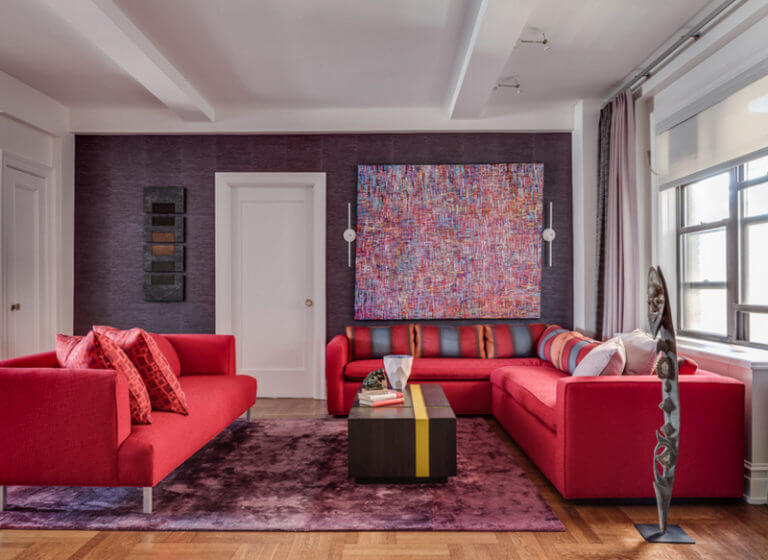 A living room decorated in red, purple and white (1)