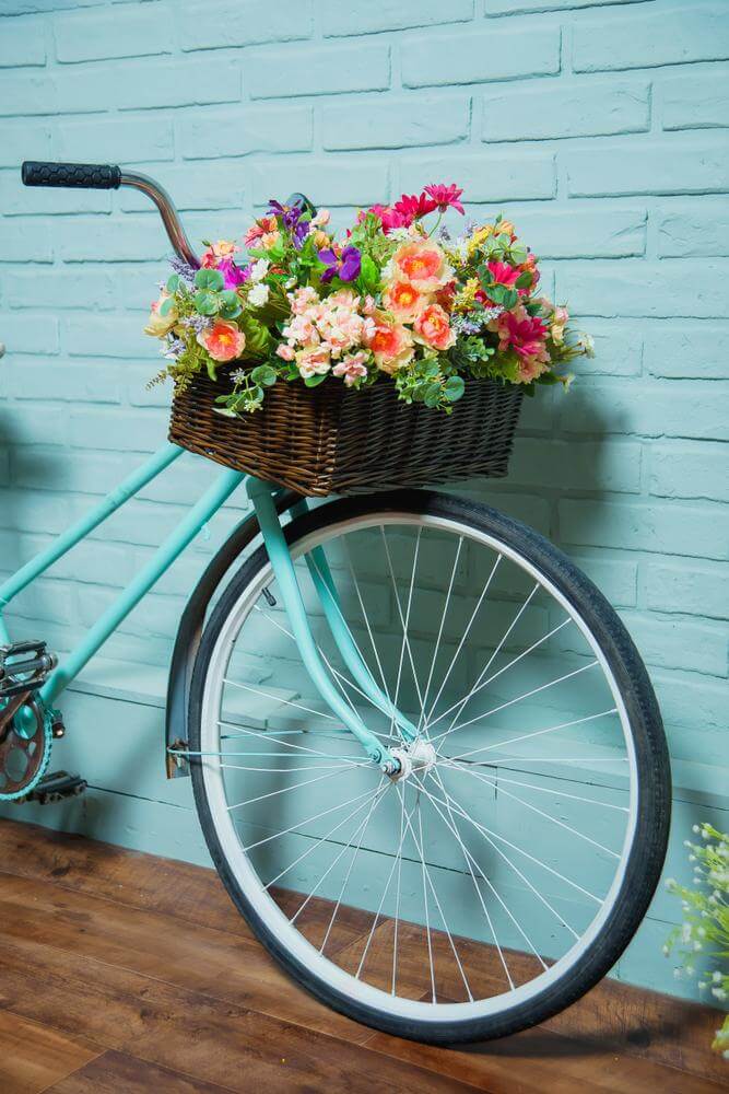 14- A FLOWERY BICYCLE LEANING AGAINST