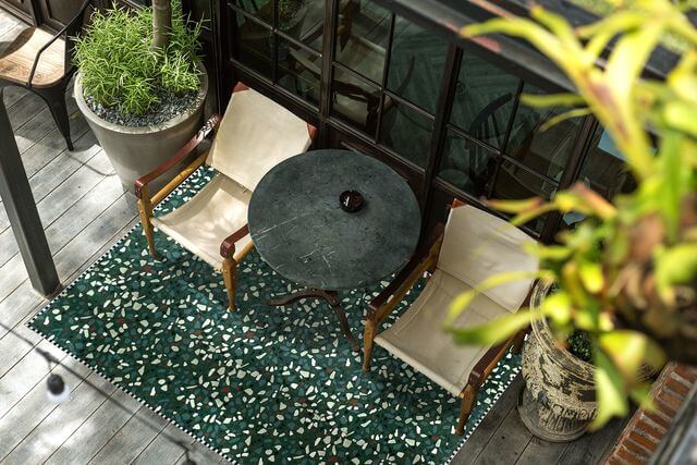 14. A terrazzo-style rug for a trendy exterior