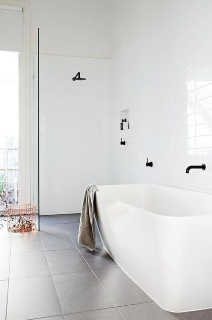 16- A white bathroom contrasted by a darker floor 