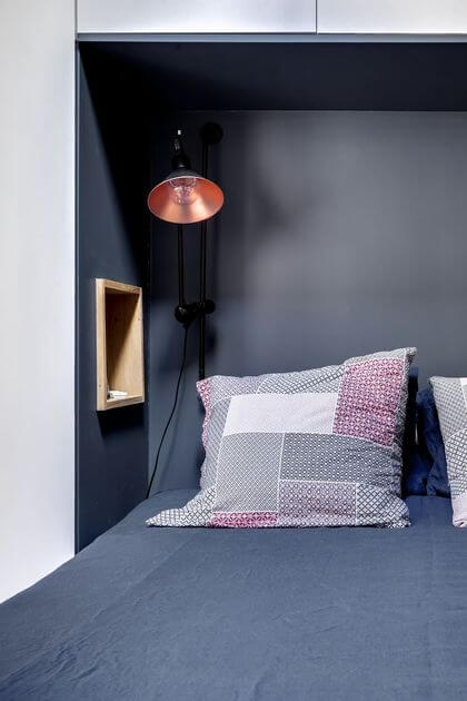29- A more than optimized headboard for an orderly bedroom 