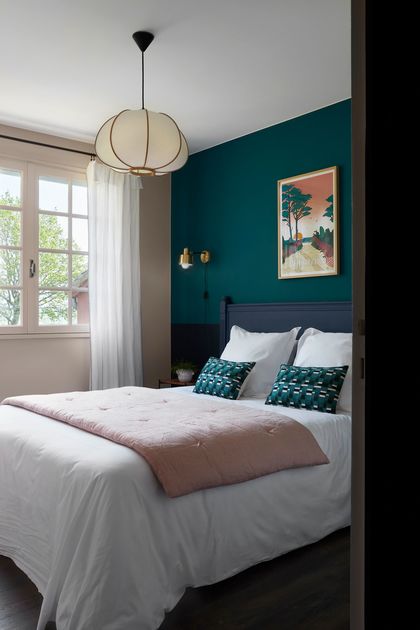 7- Intense emerald green creates a bedroom with character